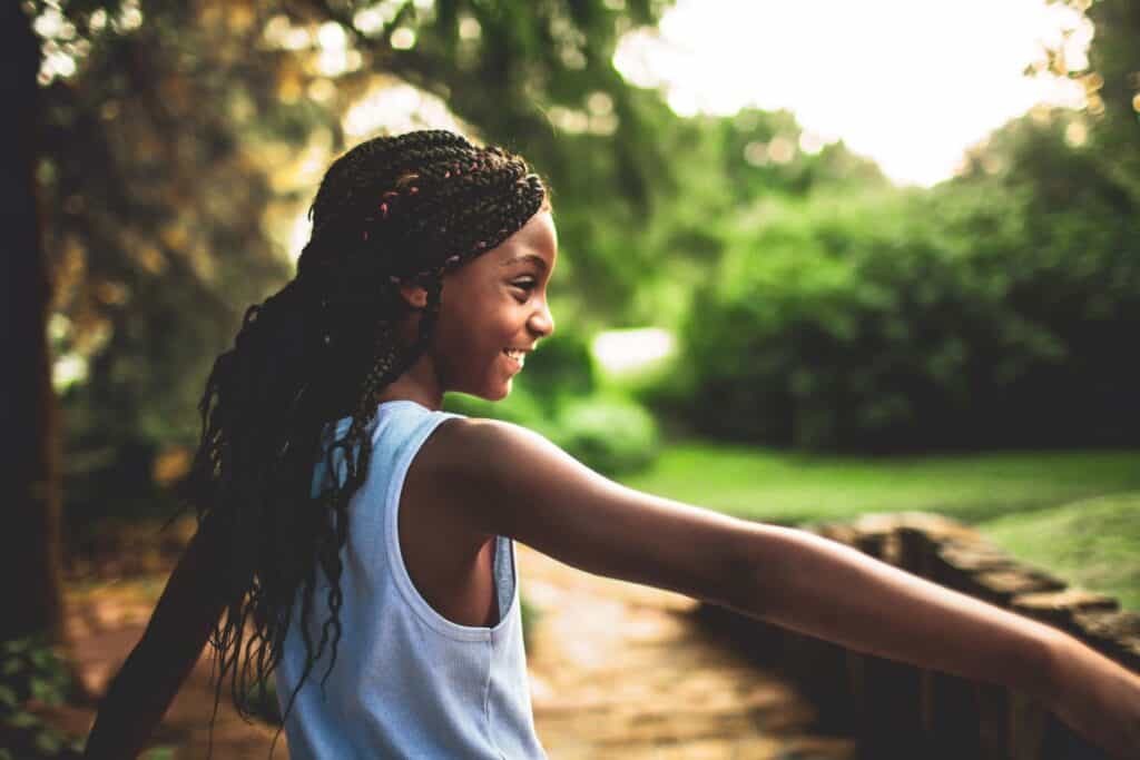 girl playing outside with safe and effective insect repellants 