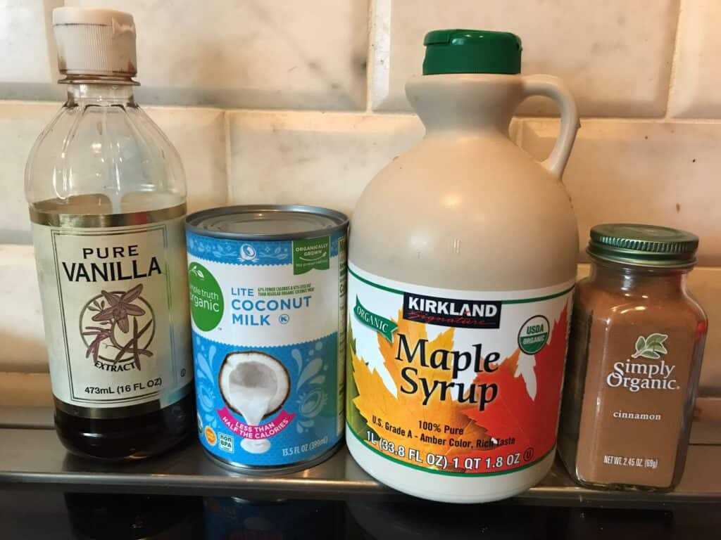 healthy homemade coffee creamer ingredients, 
vanilla, coconut milk, maple syrup, cinnamon 