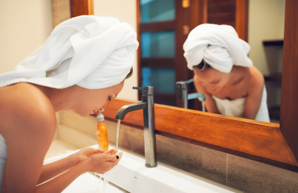 lady washing with non-toxic face wash