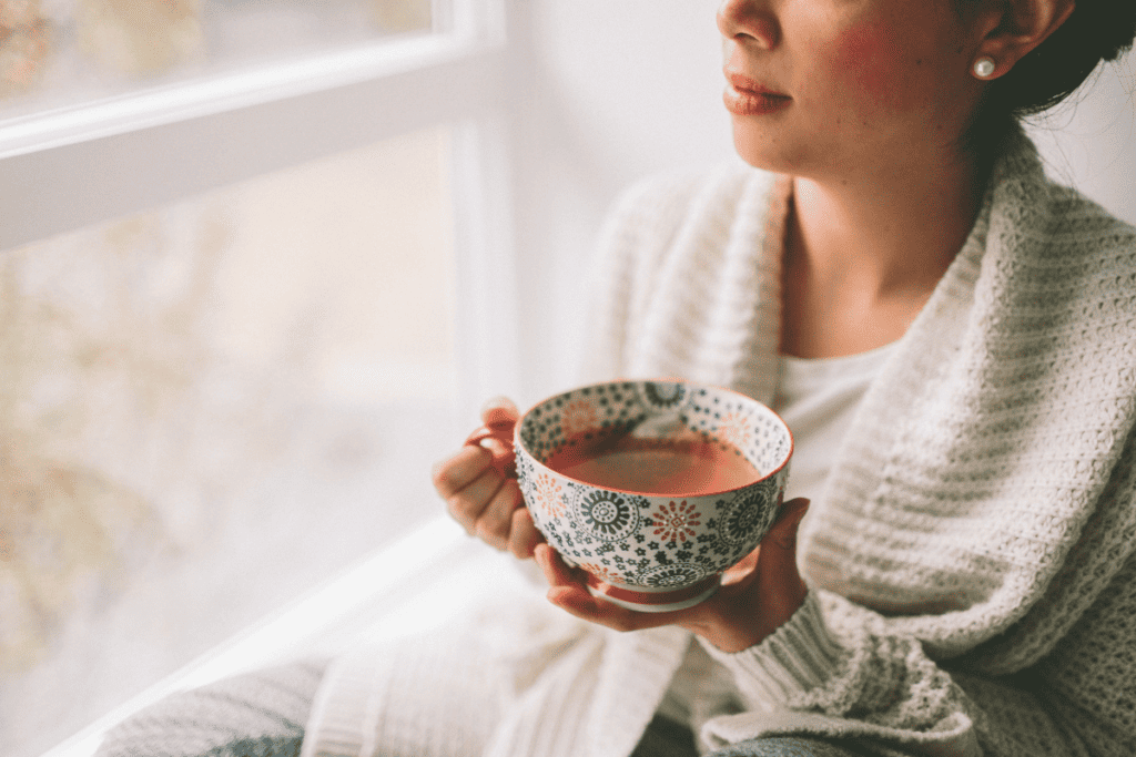 lady having tea, safe and natural ways to treat a sore throat