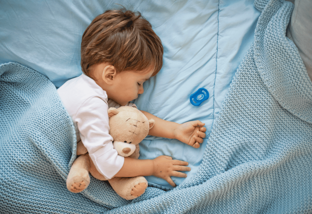 toddler sleeping on OEKO-TEX comforter