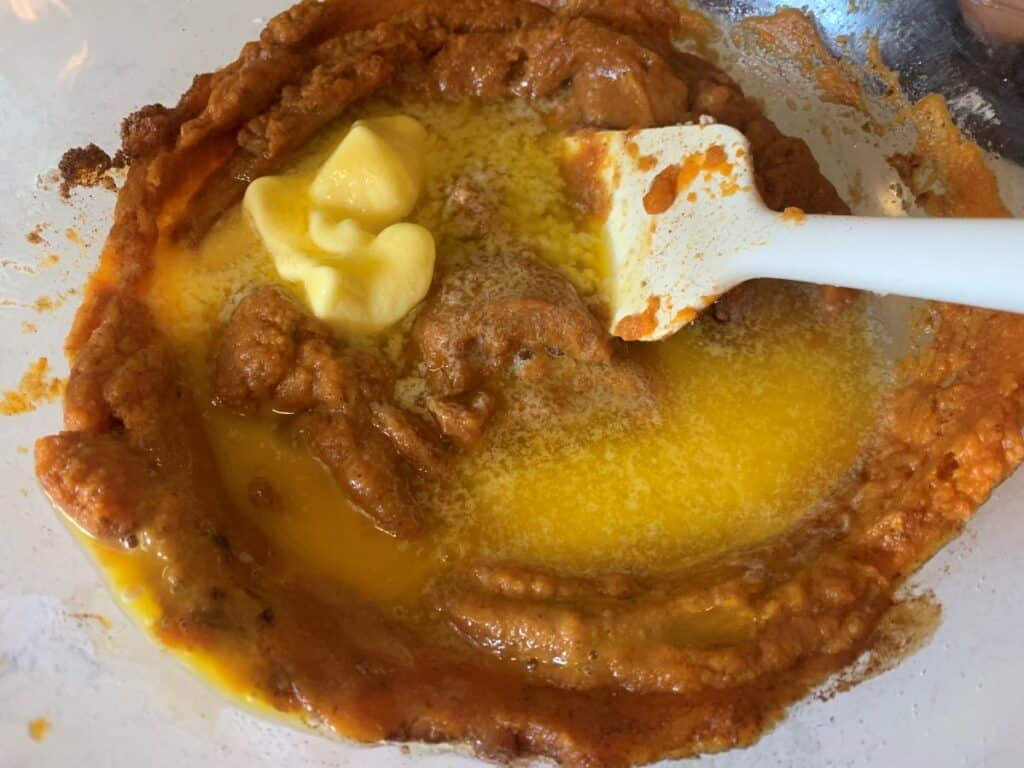 pumpkin, butter, eggs and coconut sugar in a glass mixing bowl