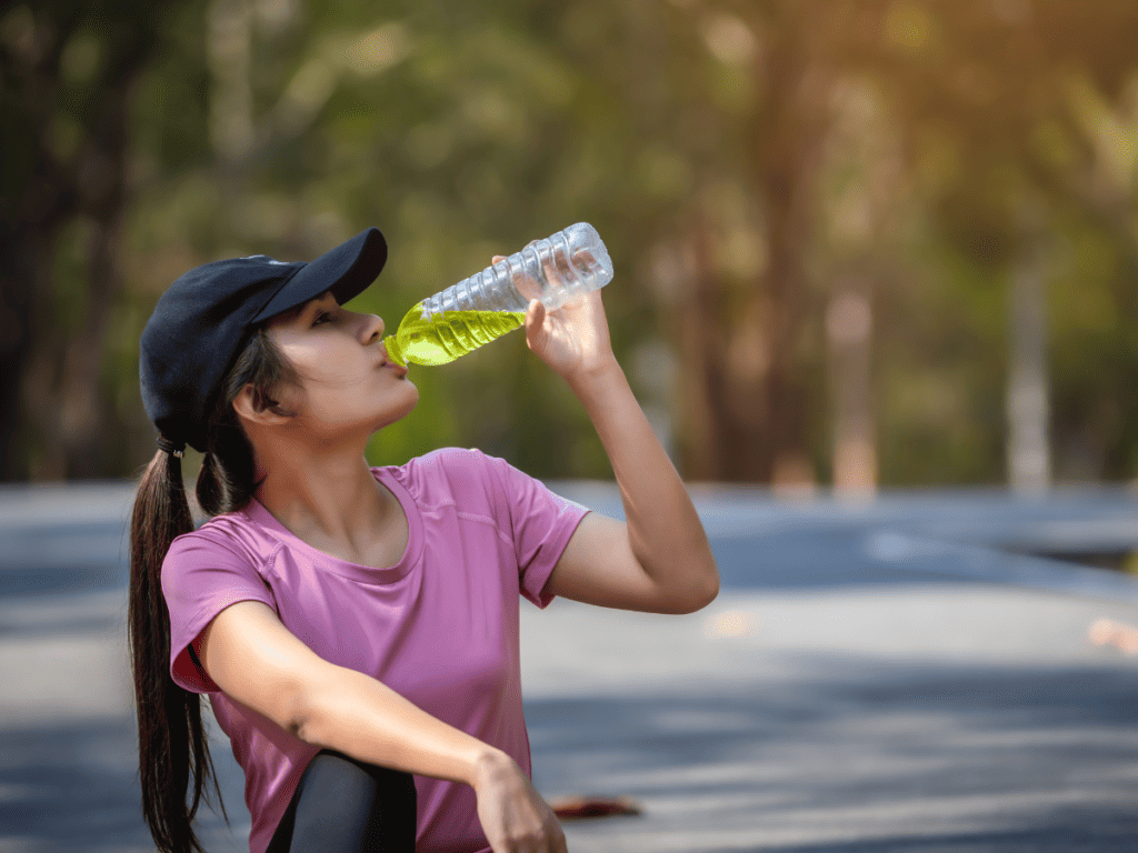 lady drinking flavored water without artificial sweeteners